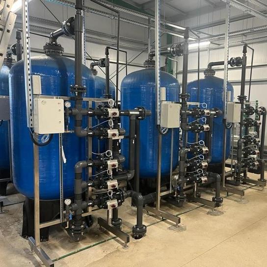Sand filter system for mechanical solids separation in industrial process water treatment — multi-layer sand bed for removal of particles, turbidity, and suspended solids.
