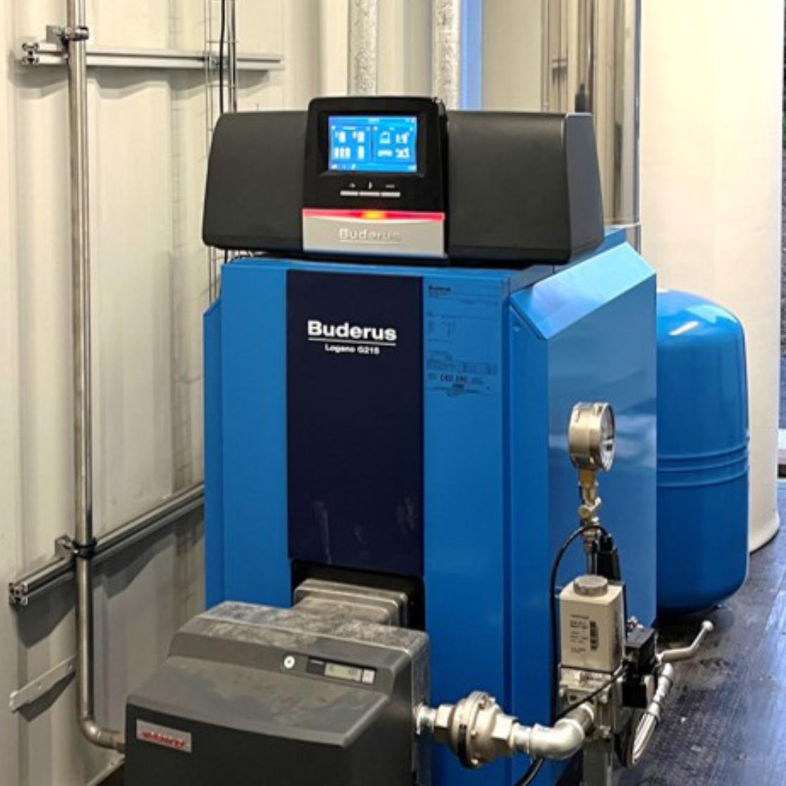 Compact Buderus boiler system with Weishaupt biogas burner in a 20 ft container for biogas utilisation — 40 kW thermal output.